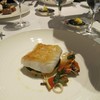 Roasted fillet of Cornish pollock with chorizo couscous, baby squid, artichoke a