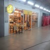 In front of the place which is located near a back exit door.