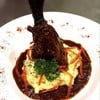 Lamb shank on mashed potato.