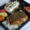 Pork tonkatsu and Japanese rice served with appetizer, salad and seasonal fruit and 1 bottle of orange juice Pork tonkatsu and Japanese rice served with appetizer, salad and seasonal fruit and 1 bottle of orange juice