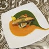 Grilled salmon and sea bass in spinach and chilli gravy