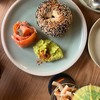 Delicious Bagel with cold smoked salmon and smashed avolcado
