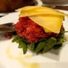 Black Angus Beef Tartare Served With Rocket Salad And Pecorino Cheese