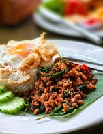 Try our delicious Pad Ka Prao (Pad Krapow) at GORD CHIANGMAI KITCHEN! This classic Thai stir-fry features fragrant basil, garlic, and chili, with your choice of meat and a perfectly crispy egg on top. It's a must-try for anyone craving authentic Thai flavors!