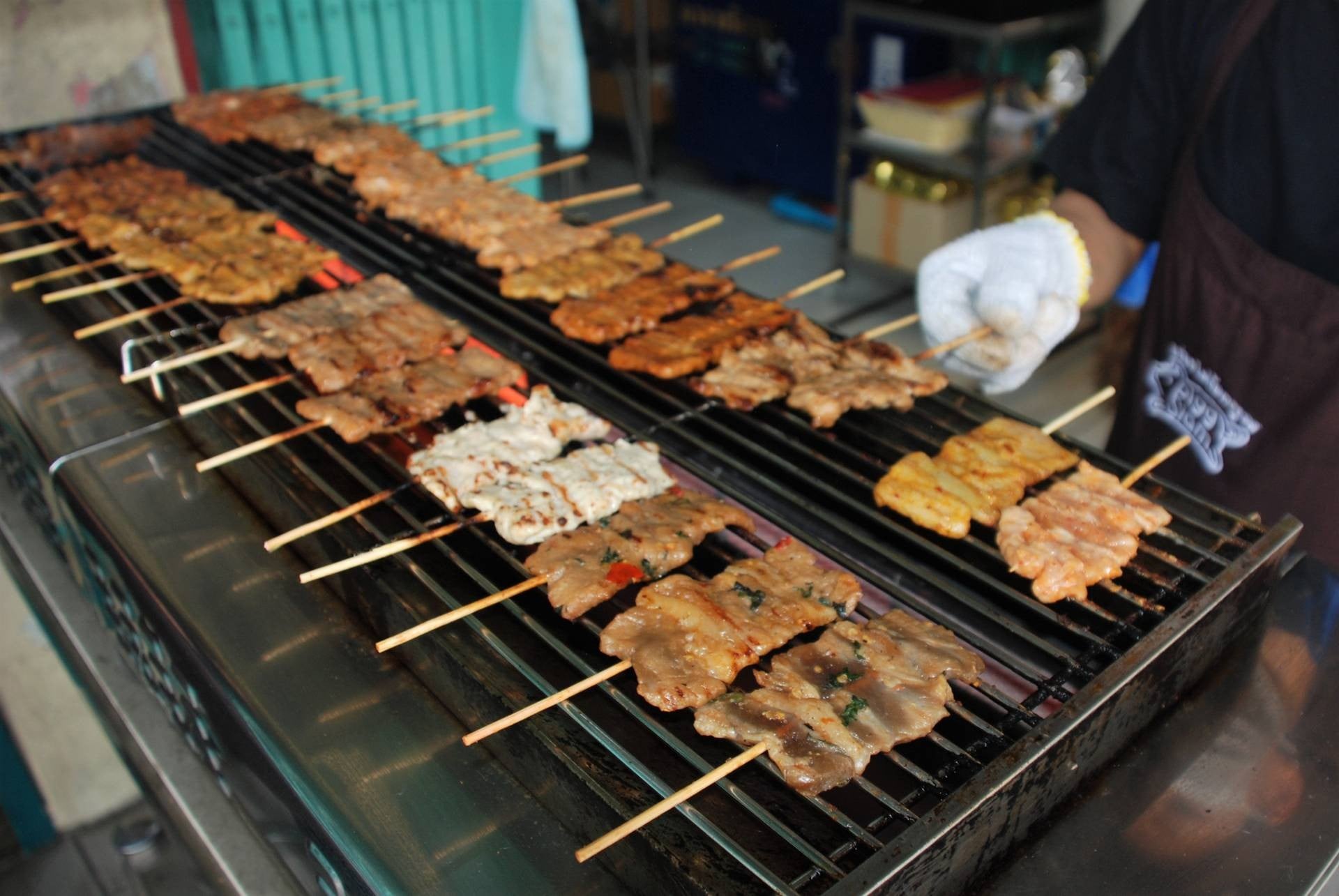 Pigg Siam pork skewers on grill