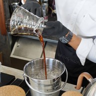 เมนูของร้าน Godmother Coffee Brew. สำนักงานใหญ่