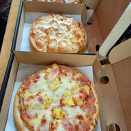 พิซซ่าอร่อย การนั่งก้อม หนองกระทิง