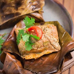 Grilled pork in banana leaf