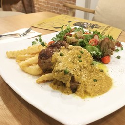 Pork chop with truffle oil in early bird sauce