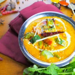 Melange of whole spices and exotic fresh vegetables cooked in handi