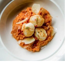 Risotto with sun-dried tomato pesto, scallop and parma ham
