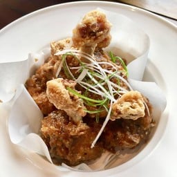 Lollipop Chicken with black pepper and pickled red peppers