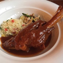 Lamb shank with pomegranate giant couscous