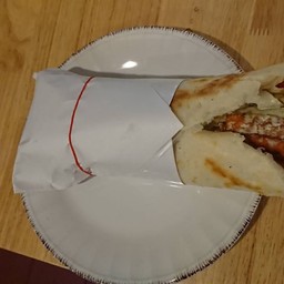 Sandwich Snitzel - sandwich with breaded chicken cutlet, hummus, chips, veggies, tahini, pickles [A5]