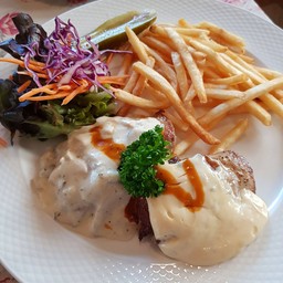 Madames Medallion  Pork steak with mushroom sauce and bearnaise sauce with frence fries