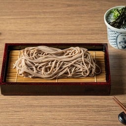 Chilled udon or soba noodles served with soy based dipping sauce