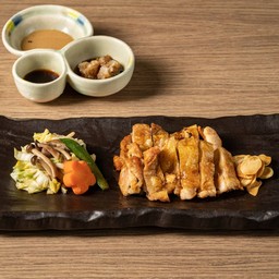 Charcoal grilled chicken thighs, served with pan fried vegetables