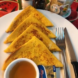 French toast served with honey and butter