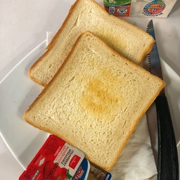 Toast served with jam and butter