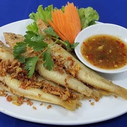 Deep fried fish with fresh turmeric