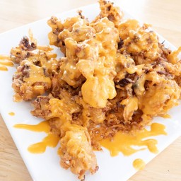 หมึกทอดราดซอสไข่เค็ม