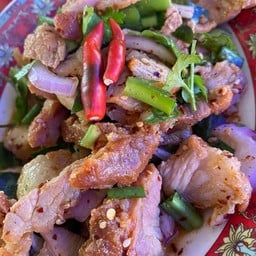 Grilled pork salad with spicy dipping sauce and fresh herbs