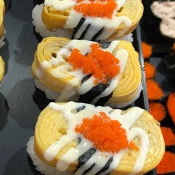 Sweet Egg Sushi with Salad and Topped with Orange Fish Roe