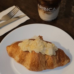 Almond croissant with coffee