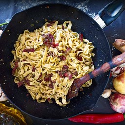 Homemade pasta aglio e olio with bacon