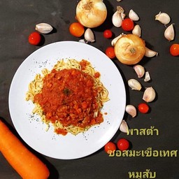 Homemade pasta with tomato sauce and minced pork.