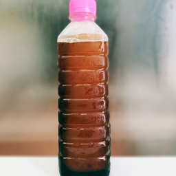 น้ำมะตูมขวด (ฝาชมพู)