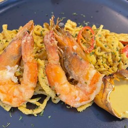 Homemade pasta with crab paste sauce and shimp