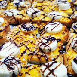 ปังปิ้งเตาถ่านข้าวโพดคลุกเนย