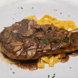 Grilled pork chop with mushroom & red wine sauce
