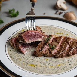 Striplion signature steak in truffle cream sauce