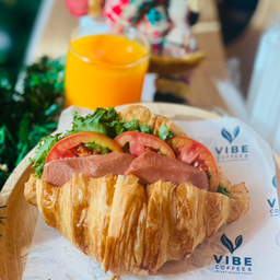 Vegan Croissant with Sausage and Orange Juice