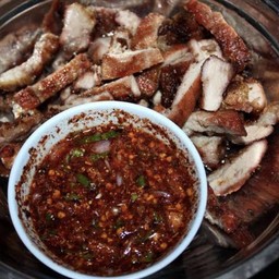 หมูย่างจิ้มแจ่ว Grilled pork served with spicy dipping sauce