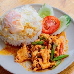 Stir Fried Chicken With Curry Paste And Fried Egg On Rice