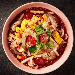 Spicy salad with sweet corn, shrimp, salted egg yolk, yam bean