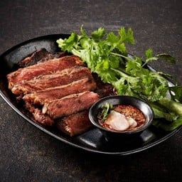 Grilled Thai brisket steak served with spicy tamarind sauce