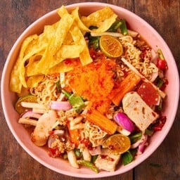 Spicy salad with instant noodles, Vietnamese sausage, salted egg yolk, chicken sausage, crab sticks, minced pork, crispy wonton, shrimp roe and yam bean