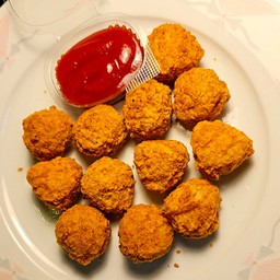 ไก่ป๊อป 12 ชิ้น + ซอสมะเขือเทศถ้วย 1 ออนซ์