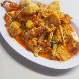 ปูม้าผัดผงกระหรี่ ( นน. ครึ่ง กก.)