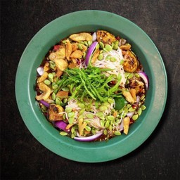Spicy fermented rice noodles salad with grilled squid eggs, crispy pork lard, white popinac and white popinac seeds