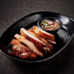 Grilled pork neck served with spicy tamarind sauce
