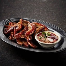 Grilled pork intestine served with spicy tamarind sauce