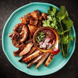 Grilled pork neck, grilled pork udder and grilled pork intestine served with spicy tamarind sauce
