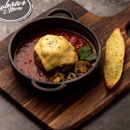 Wagyu Truffle Meatball in marinara sauce baked with Cheese