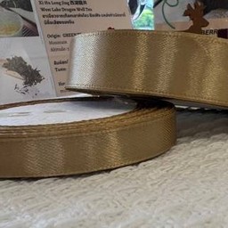 1.5 cm ริบบิ้นสีทอง หน้ากว้าง 1.5 ซม. (ราคาต่อความยาว 1 เมตร)