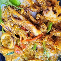 Stir Fried Squid With Curry Powder On Rice